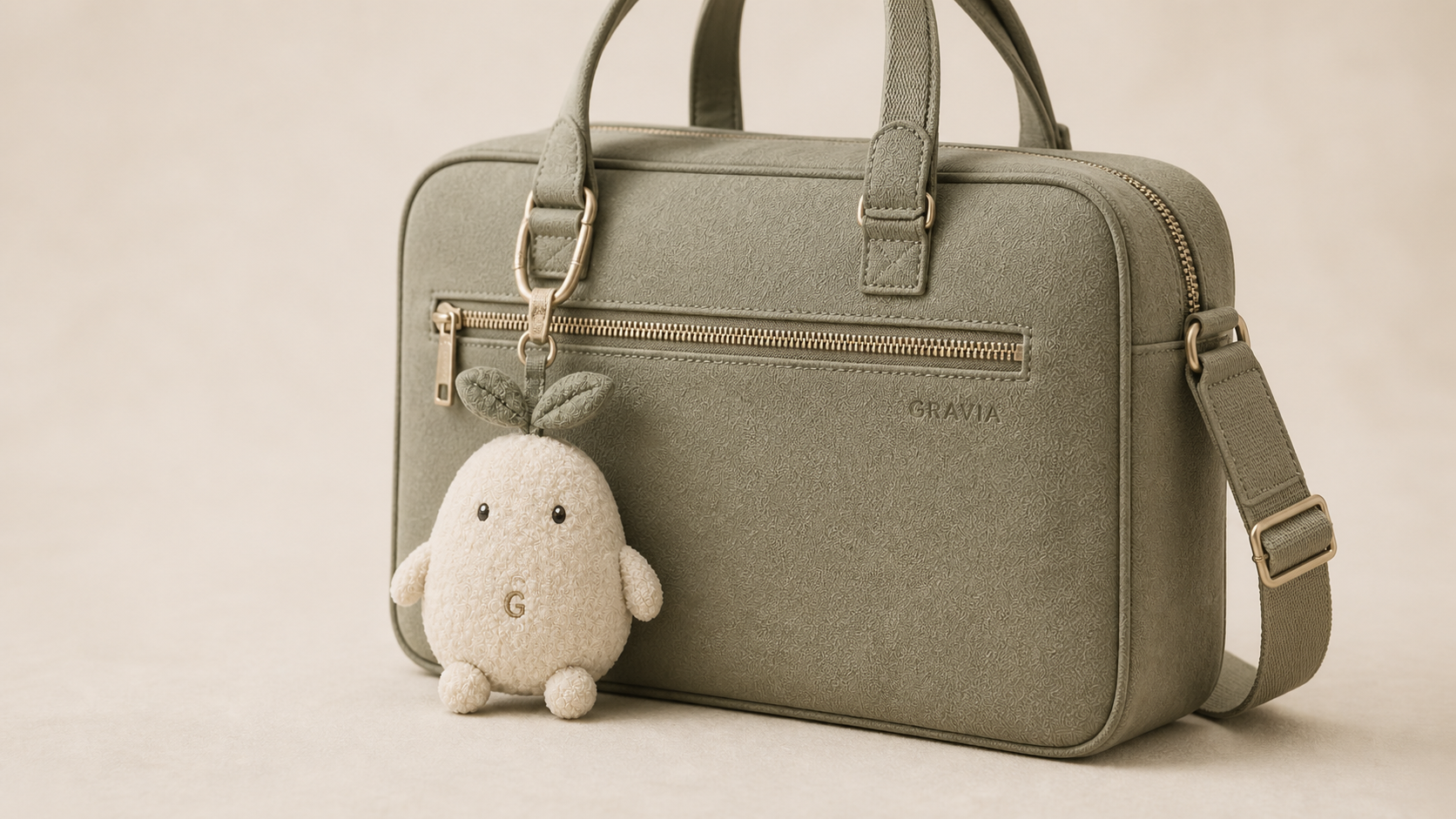 GRA plush bag charm with a sage commuter bag